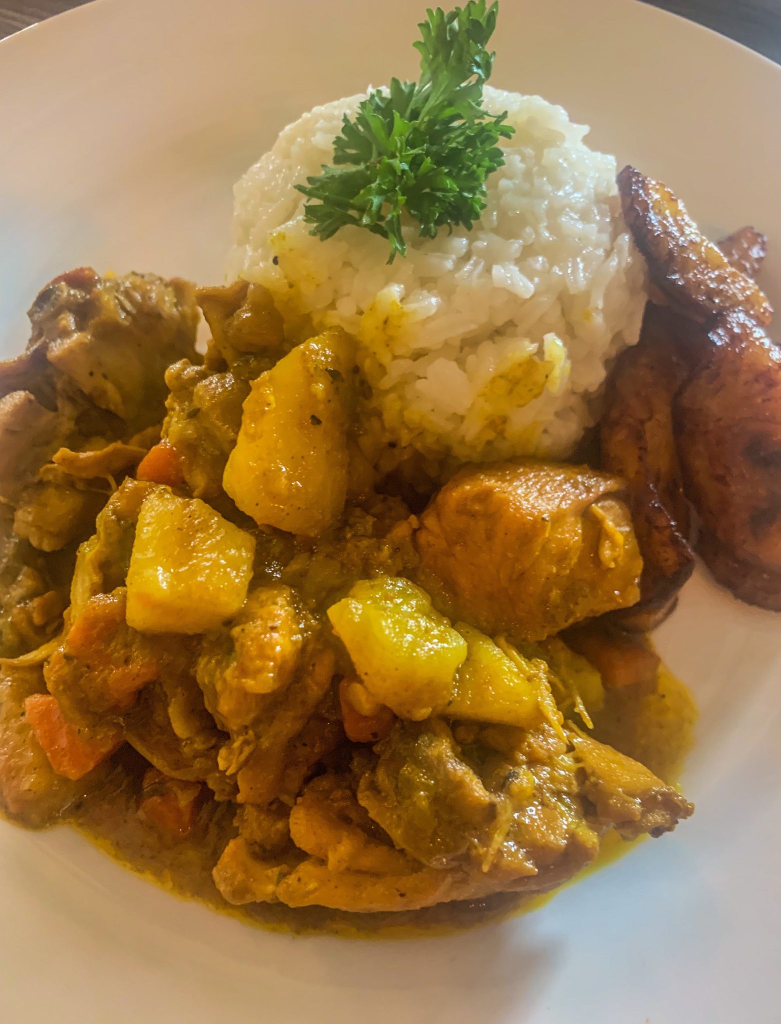 Jamaican Curry Chicken with rice and plantains