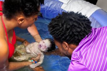 A Black couple welcoming a newborn baby into their lives after the mom gave birth at home in a birth pool.